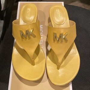 Yellow sandals by Michael Kors